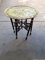 Full view of table assembled showing brass tray and wooden stand