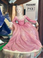 Front view of Coalport Victorian lady figurine in pink gown