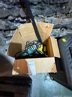 Box with Craftsman green angle grinder visible
