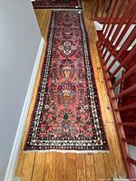 Full length view of runner rug on floor