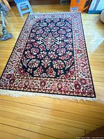 Full overhead view of the entire rug showing size, pattern, and fringe