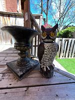 Front view of resin urn and owl statue together