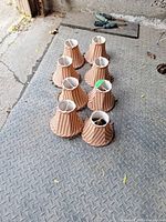All eight striped lampshades grouped on floor