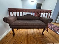 Front view of loveseat showing full shape, upholstery, cabriole legs