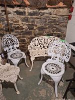 Bench and two chairs with ornate design