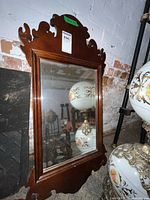 Full view of mirror showing ornate frame and overall condition