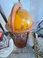 Full view of globe bar on stand