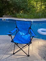 Front angled view of blue Ozark Trail folding camp chair set up