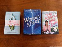 Three books laid out: Wonderstruck, If Only I Could Tell You, To All the Boys I've Loved Before