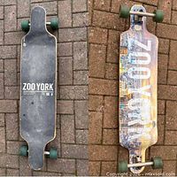 Top view showing black grip tape with Zoo York logo and wear