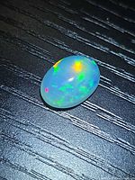 Top view of the opal showing play of colour