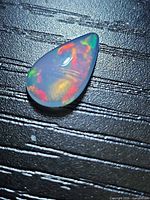 Front view of pear cabochon showing size and color play