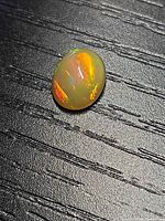 Top view of oval opal showing play of color