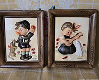 Both Napco bisque wall plaques side by side