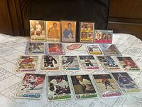 Overview of all vintage hockey cards laid out on table