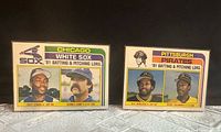 Front view of both 1982 Topps team checklist cards side by side