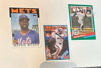 Front of three Mookie Wilson baseball cards displayed side by side