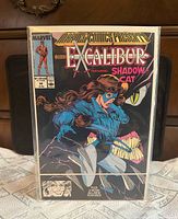 Front view of bagged comic displaying cover art and title