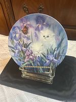 Front view of Garden Discovery plate showing kitten and iris artwork