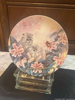 Front view of decorative plate with kittens and lilies