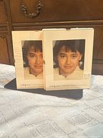 Front view of both 8x10 inch Insta Frame picture frames in packaging