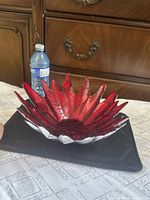 Top view showing red glass petals and bowl shape