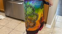 Sarong tied around waist showing overall fit and rainbow colours