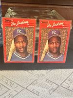 Front view of both Bo Jackson MVP cards in sleeves