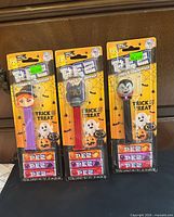 Front view of all three sealed Pez Trick or Treat Halloween dispensers