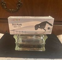 Front of sealed D11 Plus Smart Glass box on stand