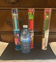 Front view of all three sealed PEZ dispensers for scale