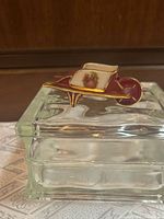 Top view of wheelbarrow trinket box on glass base