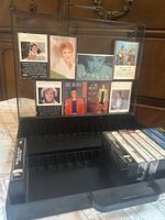 Open cassette case showing artwork inserts and tapes