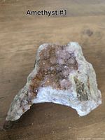 Front view of the raw amethyst cluster showing purple crystal formation and matrix
