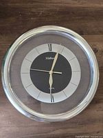Front view of Waltham wall clock showing face, hands and frame