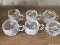 Full set showing four cups, creamer, sugar bowl lid off