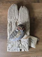 Front view showing painted rock owl and driftwood base