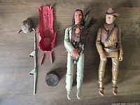 Front view of both figures with accessories laid out
