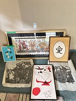 Overall lot showing six artworks including papyrus, calligraphy piece, abstract, floral, two ink rubbings