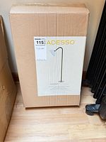 Factory-sealed box showing Adesso Gander floor lamp image and label