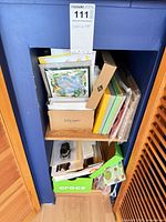 Shelf with boxed card sets, Sperry and other boxes, envelopes, gift bag