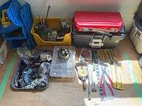 overall view of toolboxes, organizers, drill bits, pliers and bins