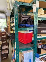 Full view of rack loaded with items, shows color, uprights, shelf count