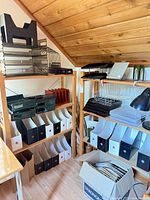Wide view: two wooden bookcases filled with various organizers, trays and lamp