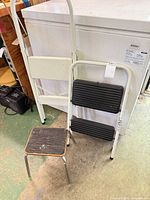 tall folding stool, small square stool in front