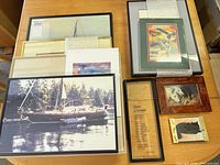 Overview of all framed artworks on table