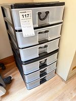 plastic six-drawer storage tower, clear drawers, black frame