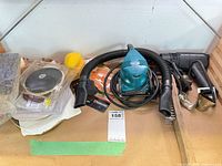Overall view of sander, heat gun, hose, accessories