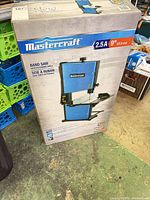 Retail box front showing Mastercraft 9" band saw and specifications