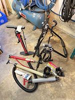 Group shot showing floor pump, trunk rack, cable locks and hand pumps